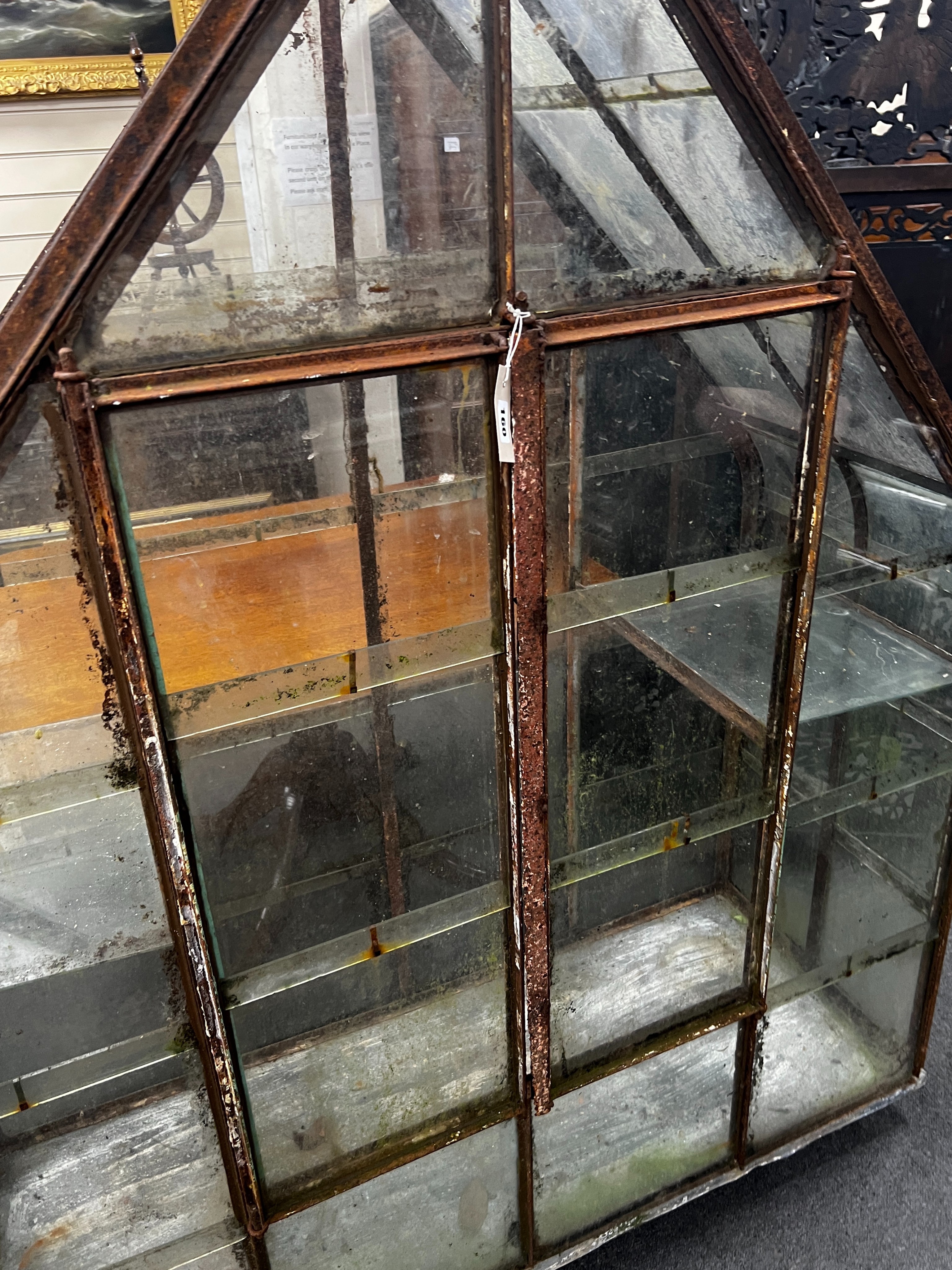 A vintage arched greenhouse on wheeled base, width 136cm, depth 51cm, height 174cm